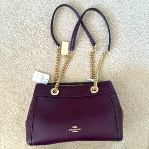 NWT COACH DOCTOR BAG. BURGUNDY LEATHER WITH GOLD CHAIN HANDLES.